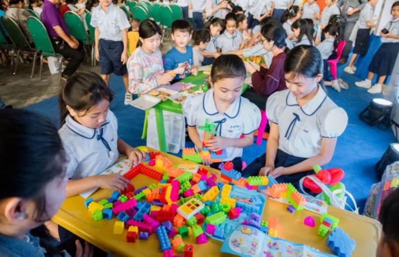 Children play with building blocks