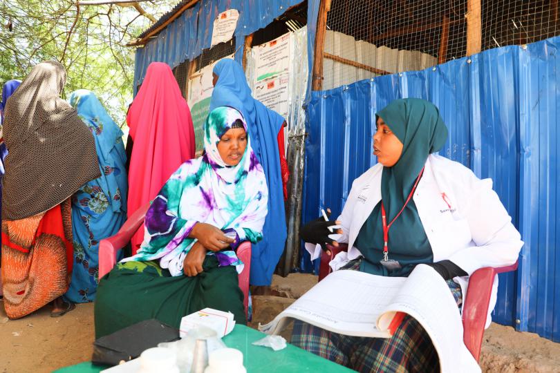 Hodan during her follow up with a health worker at the mobile health clinic.