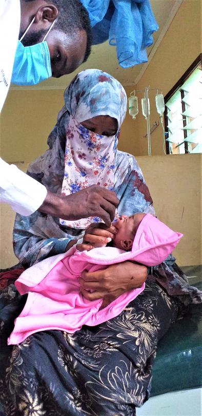 Halima's baby receiving first vaccinations