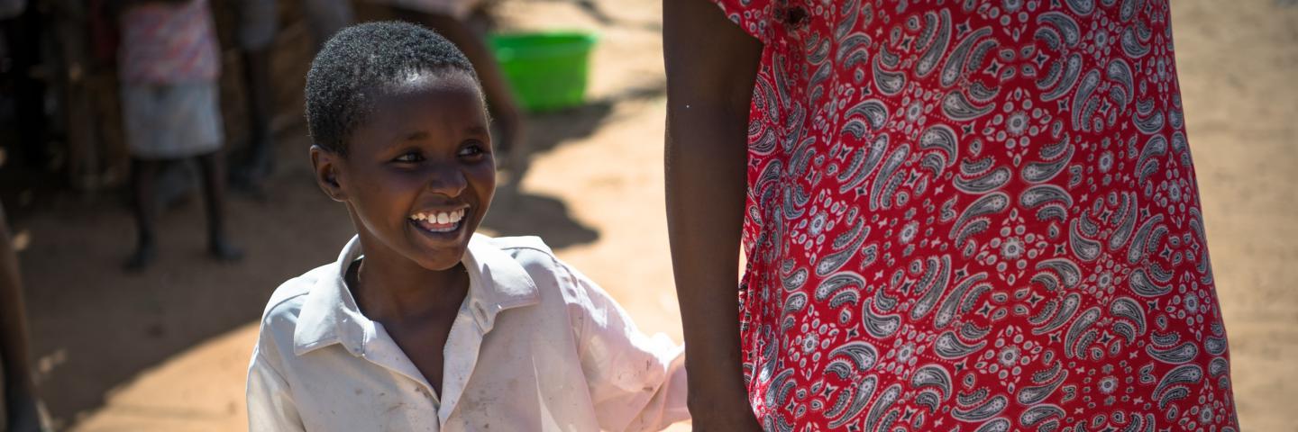 Josephine, 9 years old, walking with her mum Celina in Lodwar, Turkana.