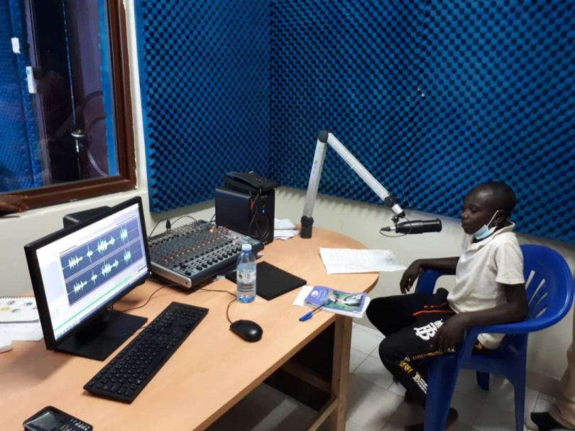 Children on the radio in western Uganda to talk about Covid-19