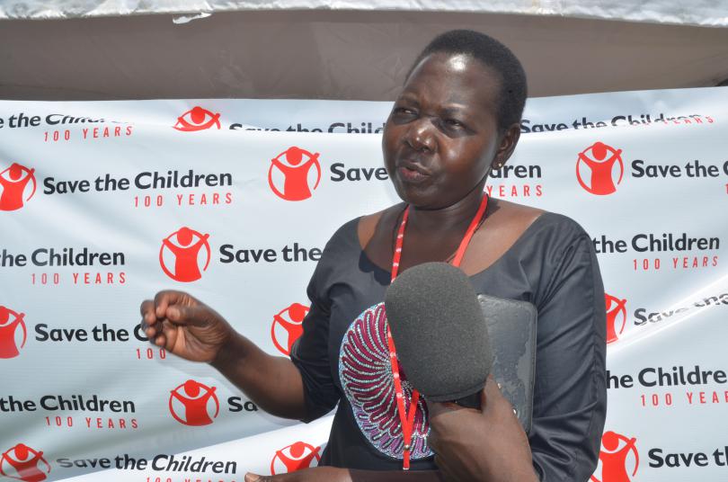 Save the Children's Regional Area Manager Coreen Auma speaks to the media about child marriage. Immaculate Nalubyayi / Save the Children