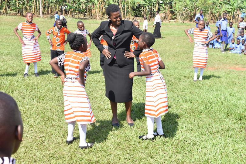 The headmistress joins pupils in celebration dancing