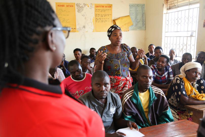 Aidah from Save the Children meets with community members to discuss and promote the reading clubs. Alun McDonald / Save the Children