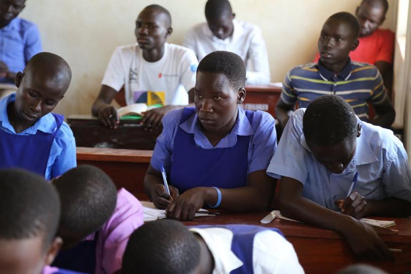 Juliet, centre, back in school at the Accelerated Education Programme. Alun McDonald / Save the Children