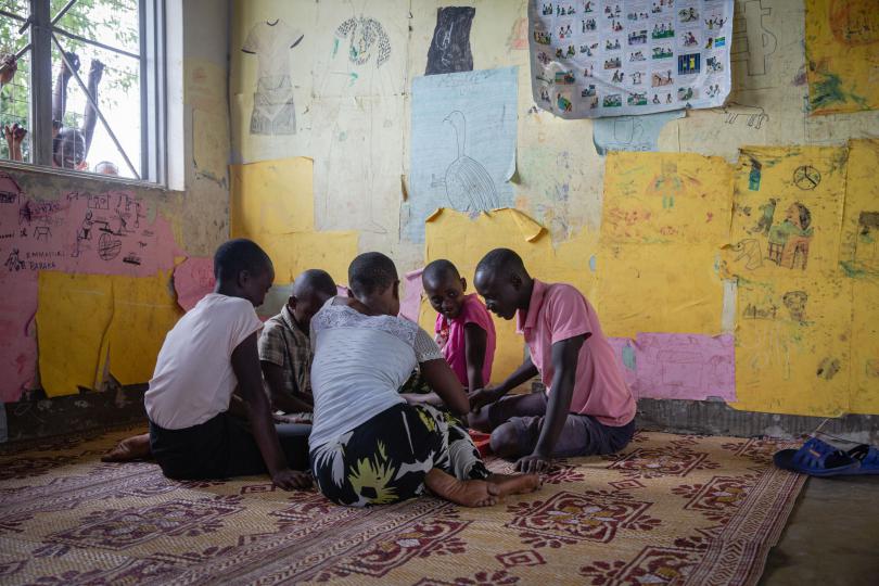 Rehim plays ludo with her friends at Save the Children's Child Friendly Space. Esther Mbabazi / Save the Children