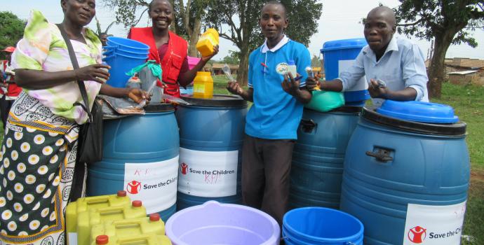 Parents receive the soap making equipment