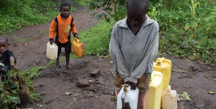 Children in Kyarugomoka collect clean safe water from their new supply