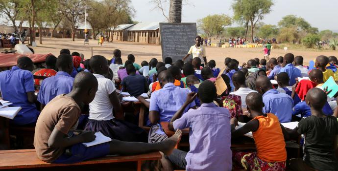 Children learn outdoors in Palorinya refugee settlement. Alun McDonald / Save the Children