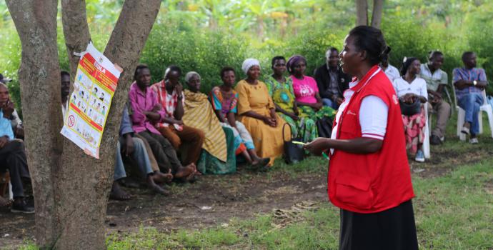 Rose Namugerwa of Save the Children speaks to the community about Ebola. Alun McDonald / Save the Children