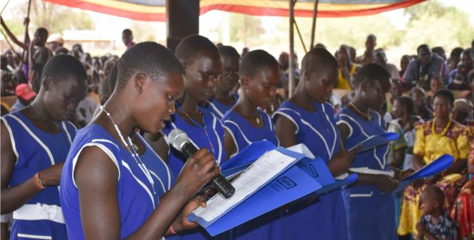 Girls speak against child marriage at the event in Kotido