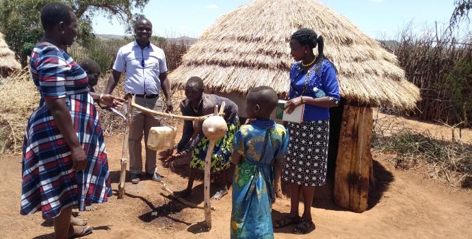 Officials inspect latrines in Lokansenyak village