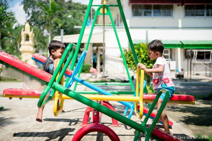  Abu (right) and Bassam (left) play at the shelter playground.